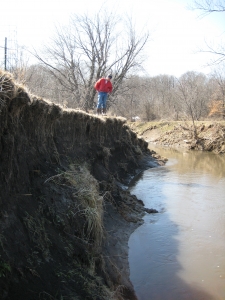 A person walking on a streambank