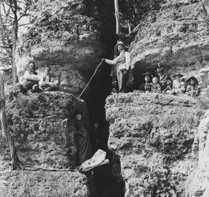 Old photo of people on a cliff