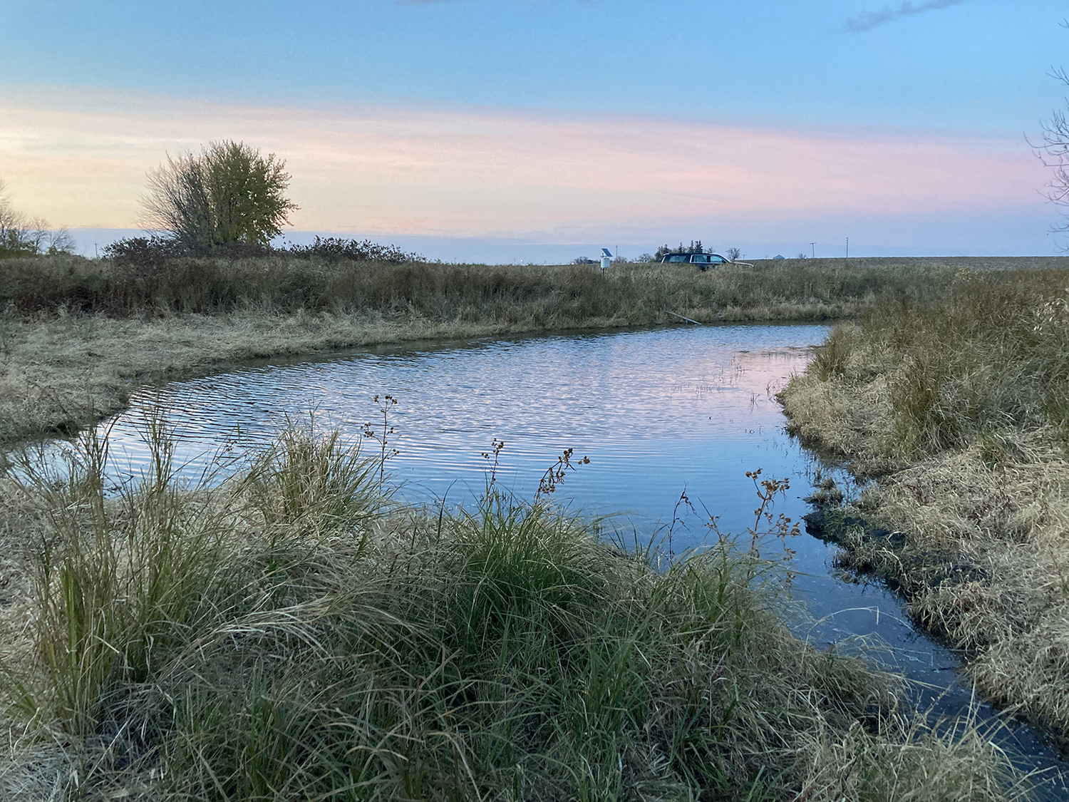 Sunset over an oxbow in late summer.