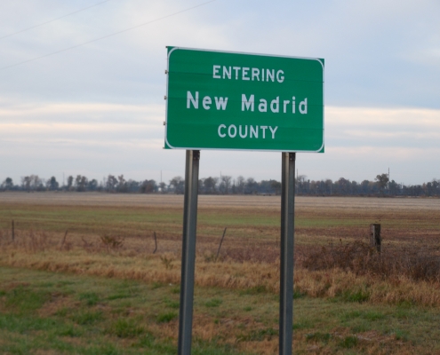 Road sign announcing entrance to New Madrid County
