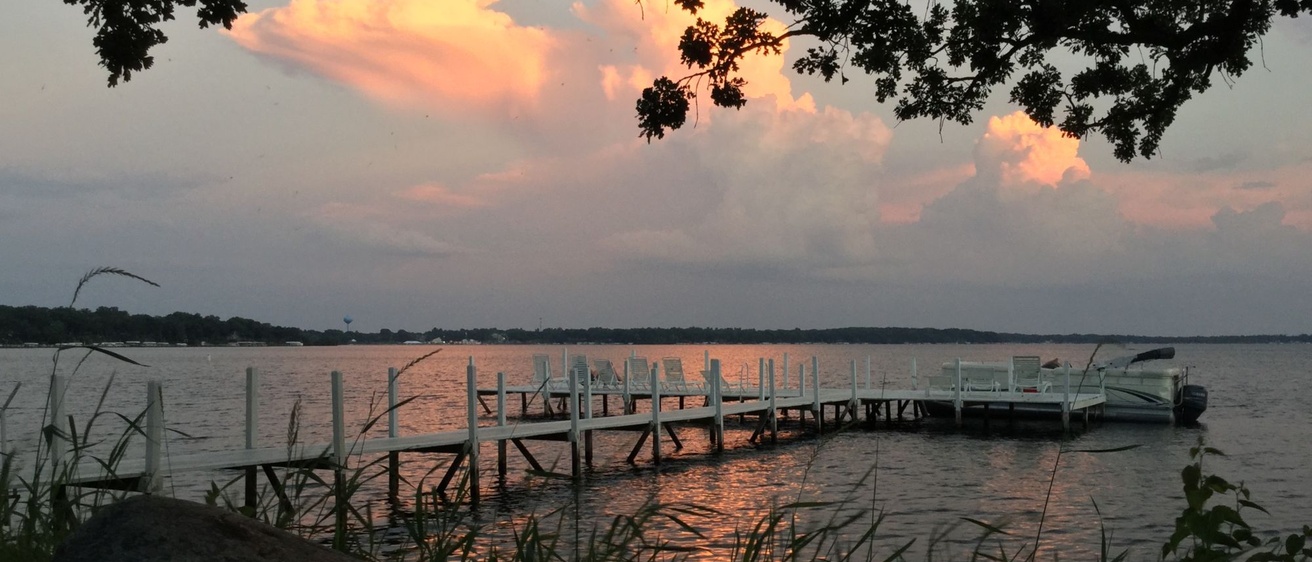 Sunset lights up the clouds over West Lake Okoboji